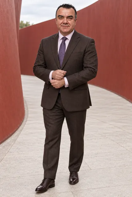 Stuart Newman in a chocolate flannel suit, full length